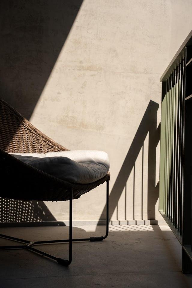 A lounge chair on a sunny terrace